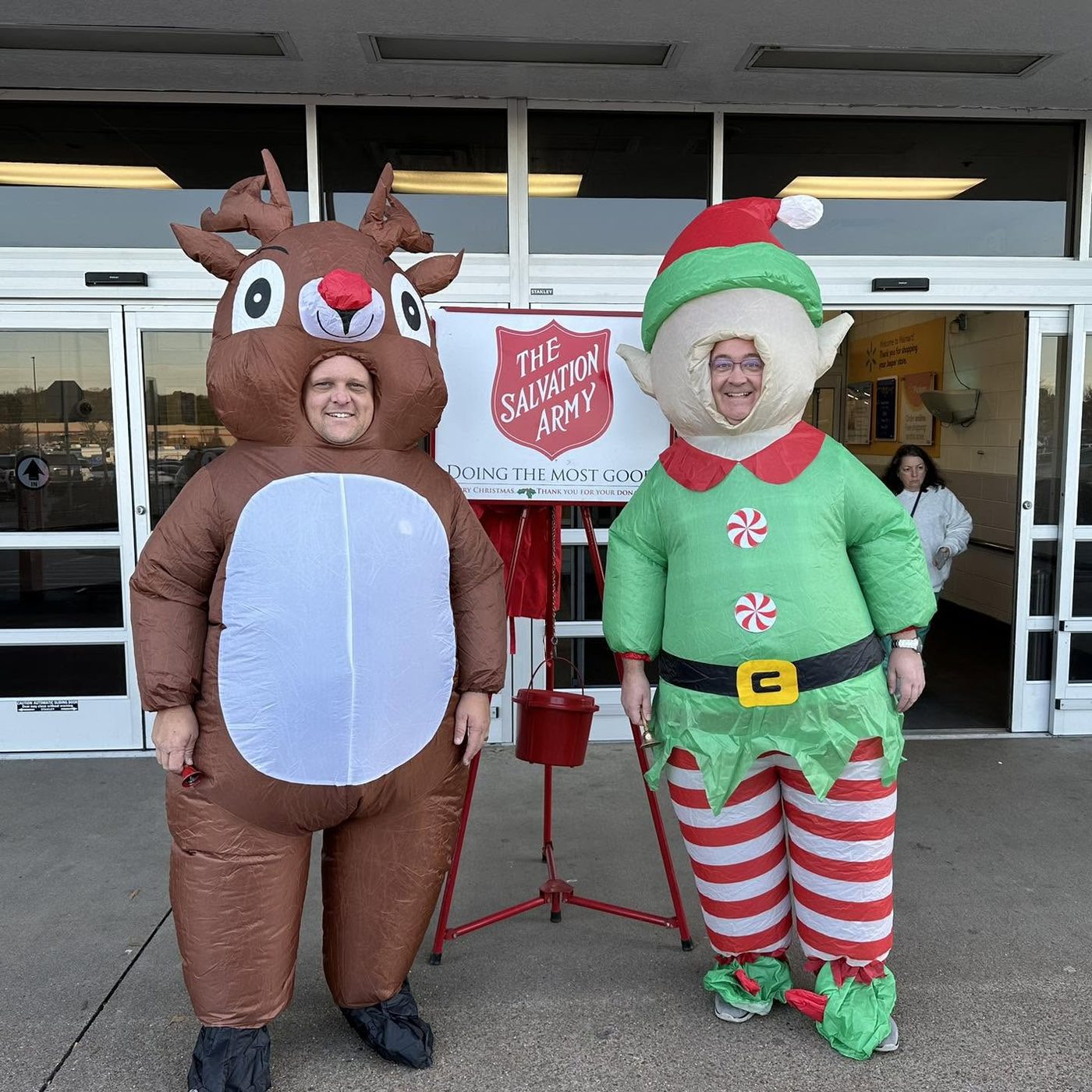 Kiwanis members ringing bells for the Salvation Army Red Kettle Campaign